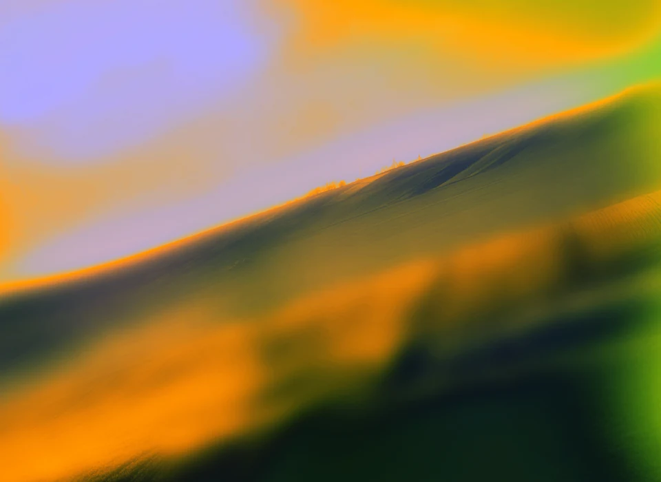 A softly blurred hillside in golden orange and green beneath a violet sky.